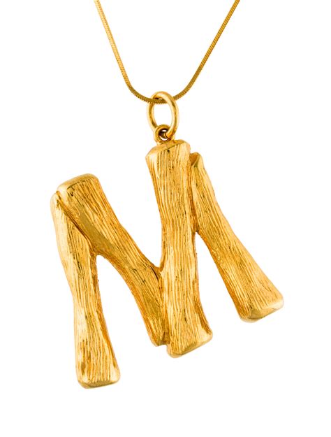 women celine alphabet necklace in brass|celine alphabet.